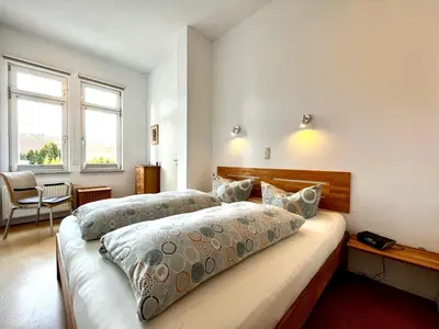 Ein Bett oder Betten in einem Zimmer der Unterkunft FeWo Kleine Hexe
