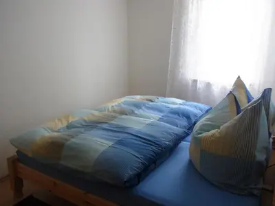 Ein Bett oder Betten in einem Zimmer der Unterkunft Ferienhaus Appold