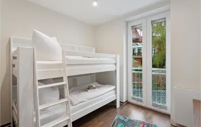 Ein Bett oder Betten in einem Zimmer der Unterkunft Suite Am Bleek Og