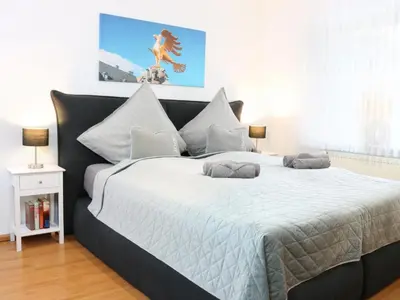Ein Bett oder Betten in einem Zimmer der Unterkunft Heimat Goslar Apartments “Zur Kaiserpfalz“