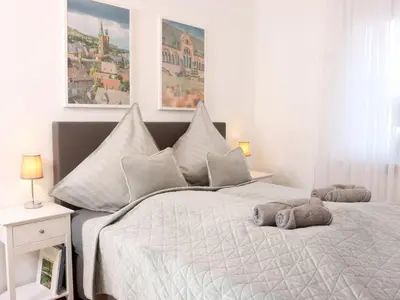 Ein Bett oder Betten in einem Zimmer der Unterkunft Heimat Goslar Apartments 