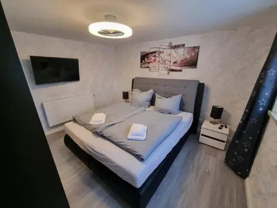 Ein Bett oder Betten in einem Zimmer der Unterkunft Haus Ilse Wohnung 6