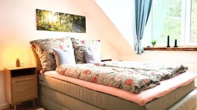 Ein Bett oder Betten in einem Zimmer der Unterkunft Ferienwohnung Berglodge 22