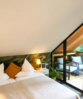 Ein Bett oder Betten in einem Zimmer der Unterkunft DAS Chalet mit Schlossblick in Wernigerode