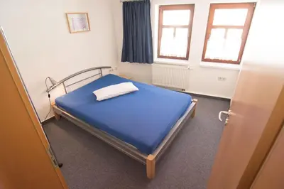 Ein Bett oder Betten in einem Zimmer der Unterkunft Urlaub in Stolberg, FeWo OG