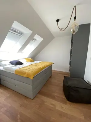 Ein Bett oder Betten in einem Zimmer der Unterkunft Ferienhaus Mountain View Six53 mit Sauna und Kamin in St. Andreasberg