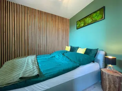 Ein Bett oder Betten in einem Zimmer der Unterkunft LIGHTQUARTIER Mountain Nest -Balkon