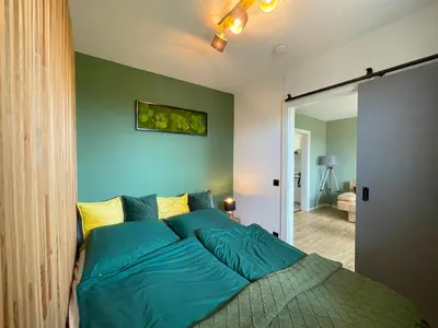 Ein Bett oder Betten in einem Zimmer der Unterkunft LIGHTQUARTIER Mountain Nest -Balkon