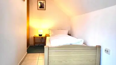 Ein Bett oder Betten in einem Zimmer der Unterkunft Ferienwohnung Bocksberg Hexe Hahnenklee