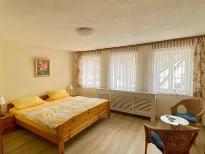 Ein Bett oder Betten in einem Zimmer der Unterkunft Ferienwohnung WACHE im HAUS GERLACH