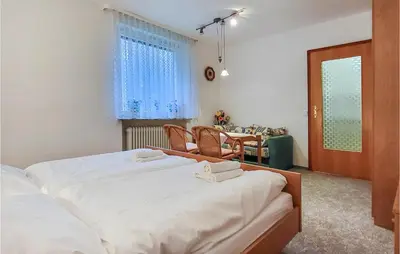 Ein Bett oder Betten in einem Zimmer der Unterkunft Nice Apartment In Goslar Ot Hahnenklee