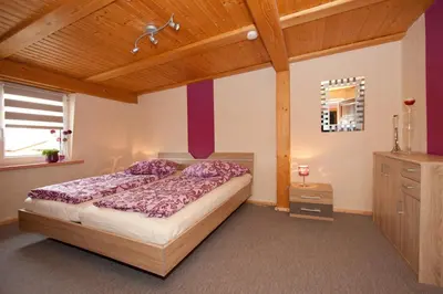 Ein Bett oder Betten in einem Zimmer der Unterkunft Ferienwohnung Uwe's Sporthütte