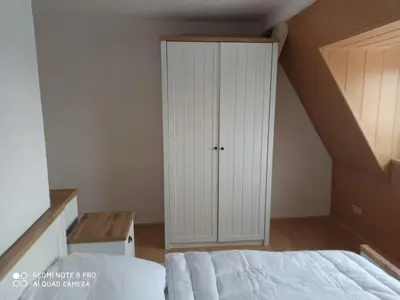 Ein Bett oder Betten in einem Zimmer der Unterkunft Ruhige, gemütliche Ferienwohnung in Zentrumsnähe