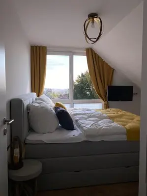 Ein Bett oder Betten in einem Zimmer der Unterkunft Ferienhaus Mountain View Six50 mit Sauna und Kamin in St. Andreasberg