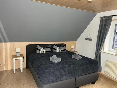 Ein Bett oder Betten in einem Zimmer der Unterkunft Ferienhaus Auszeit Harz Braunlage/Hohegeiß