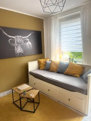 Ein Bett oder Betten in einem Zimmer der Unterkunft FeWo Am Kanonenberg 2
