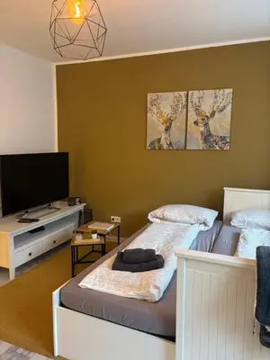 Ein Bett oder Betten in einem Zimmer der Unterkunft FeWo Am Kanonenberg 2