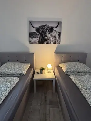 Ein Bett oder Betten in einem Zimmer der Unterkunft FeWo Am Kanonenberg 2
