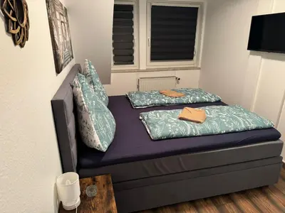 Ein Bett oder Betten in einem Zimmer der Unterkunft Blue Wave