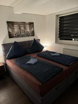 Ein Bett oder Betten in einem Zimmer der Unterkunft Blue Wave