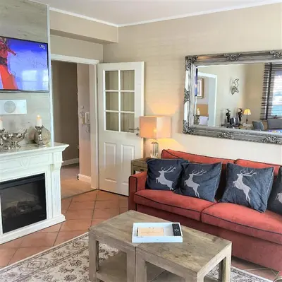 Ein Sitzbereich in der Unterkunft Luxus Ferienwohnung Hirschzeit