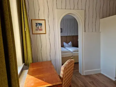 Ein Bett oder Betten in einem Zimmer der Unterkunft Harz Hotel Waldhaus