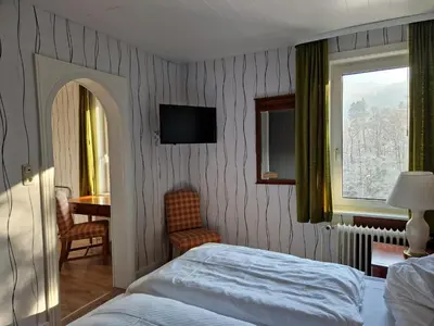 Ein Bett oder Betten in einem Zimmer der Unterkunft Harz Hotel Waldhaus