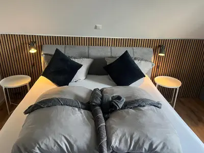 Ein Bett oder Betten in einem Zimmer der Unterkunft Ferienwohnung Wurmbergblick