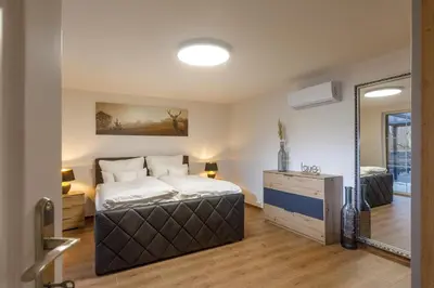 Ein Bett oder Betten in einem Zimmer der Unterkunft Ferienhaus am Wald
