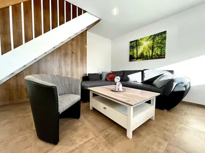Ein Sitzbereich in der Unterkunft Ferienhaus Leni Bettwäsche Handtücher inkl