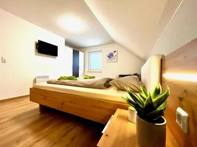 Ein Bett oder Betten in einem Zimmer der Unterkunft Ferienhaus Leni Bettwäsche Handtücher inkl