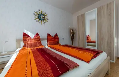 Ein Bett oder Betten in einem Zimmer der Unterkunft Ferienobjekte Familie Beck