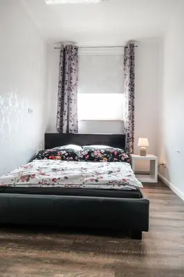 Ein Bett oder Betten in einem Zimmer der Unterkunft Ferienwohnung FANNYS