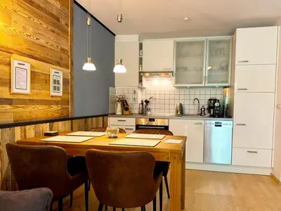 Küche/Küchenzeile in der Unterkunft STANMA Lodge Braunlage - Naturpartments am Fluss mit Sauna und Bergblick