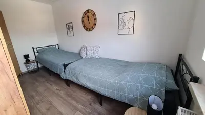 Ein Bett oder Betten in einem Zimmer der Unterkunft FeWoaufdemAdenberg