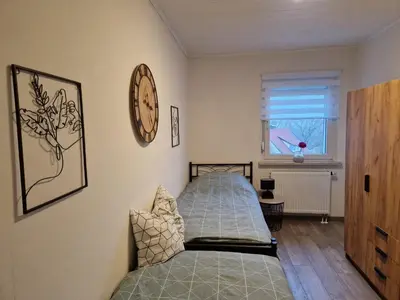 Ein Bett oder Betten in einem Zimmer der Unterkunft FeWoaufdemAdenberg