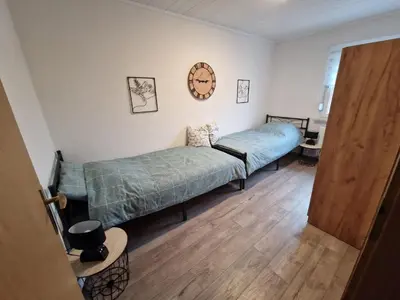 Ein Bett oder Betten in einem Zimmer der Unterkunft FeWoaufdemAdenberg