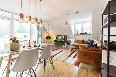 Ein Sitzbereich in der Unterkunft Waldbewohner Apartments / Hirsch