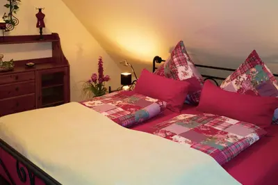 Ein Bett oder Betten in einem Zimmer der Unterkunft Ferienwohnungen Glockenberg