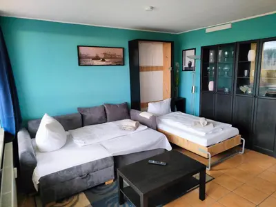 Ein Bett oder Betten in einem Zimmer der Unterkunft Apartment Walpurgis mit toller Aussicht & Schwimmbad