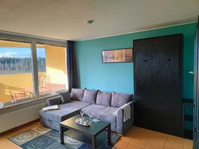 Ein Sitzbereich in der Unterkunft Apartment Walpurgis mit toller Aussicht & Schwimmbad