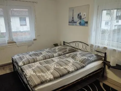 Ein Bett oder Betten in einem Zimmer der Unterkunft Harzpension Haus Königskopf