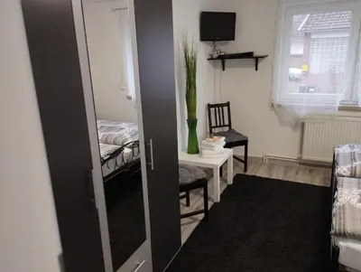 Ein Bett oder Betten in einem Zimmer der Unterkunft Harzpension Haus Königskopf