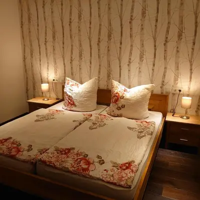 Ein Bett oder Betten in einem Zimmer der Unterkunft FeWo Elmo's Nest