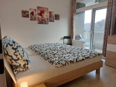 Ein Bett oder Betten in einem Zimmer der Unterkunft Ferienwohnung Penthouse Wolke 16 mit Schwimmbad und Saunanutzung