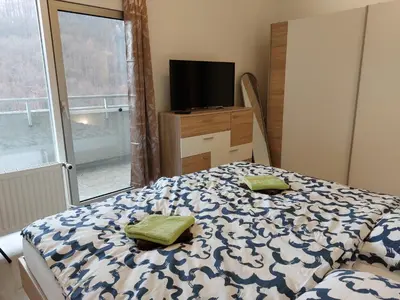 Ein Bett oder Betten in einem Zimmer der Unterkunft Ferienwohnung Penthouse Wolke 16 mit Schwimmbad und Saunanutzung
