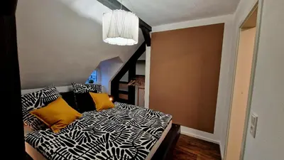 Ein Bett oder Betten in einem Zimmer der Unterkunft Harzperle Quedlinburg Ferienwohnung 41m²