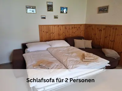 Ein Bett oder Betten in einem Zimmer der Unterkunft FeWo Berg-Domizil Bad Harzburg mit eigenem Fahrradkeller und Parkplatz, inklusive Bettwäsche und Handtüchern