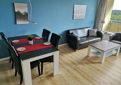 Ein Sitzbereich in der Unterkunft Apartment Harzblick - Traumaussicht & Schwimmbad
