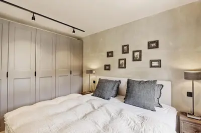 Ein Bett oder Betten in einem Zimmer der Unterkunft HOME Suites Loft mit Sauna
